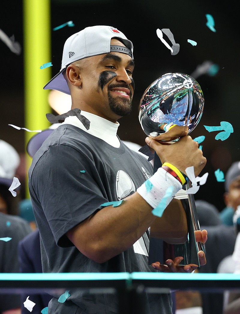 Feb 9, 2025; New Orleans, LA, USA;  Philadelphia Eagles quarterback Jalen Hurts (1) holds the Vince Lombardi Trophy after defeating the Kansas City Chiefs in Super Bowl LIX at Ceasars Superdome. Mandatory Credit: Mark J. Rebilas-Imagn Images