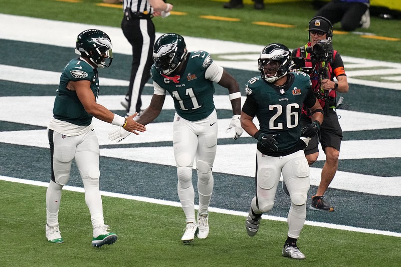 Feb 9, 2025; New Orleans, LA, USA; Philadelphia Eagles wide receiver A.J. Brown (11) reacts with quarterback Jalen Hurts (1) after making a touchdown catch against the Kansas City Chiefs during the second quarter in Super Bowl LIX at Caesars Superdome. Mandatory Credit: Kirby Lee-Imagn Images