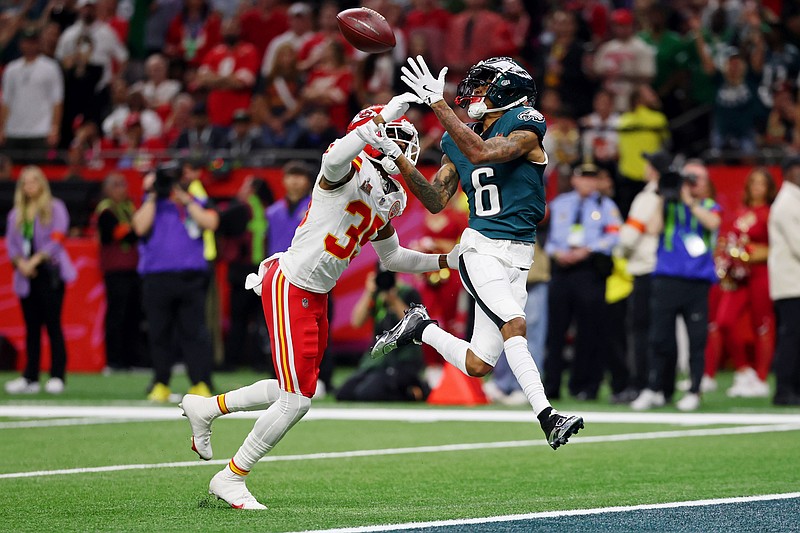 Feb 9, 2025; New Orleans, LA, USA; Philadelphia Eagles wide receiver DeVonta Smith (6) makes a catch for a touchdown against Kansas City Chiefs cornerback Jaylen Watson (35) during the second half of Super Bowl LIX at Caesars Superdome. Mandatory Credit: Geoff Burke-Imagn Images