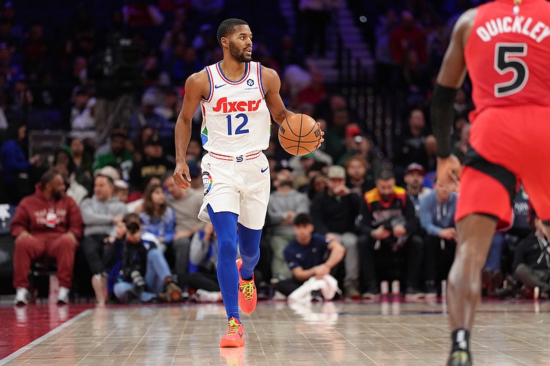 Feb 11, 2025; Philadelphia, Pennsylvania, USA; Philadelphia 76ers guard Jared Butler (12) controls the ball against the Toronto Raptors in the second quarter at Wells Fargo Center. Mandatory Credit: Kyle Ross-Imagn Images