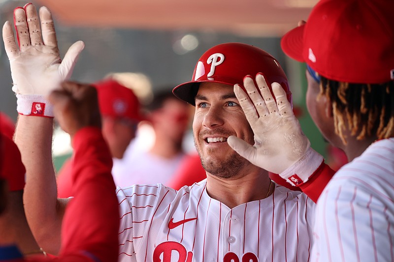 Feb 28, 2024; Clearwater, Florida, USA; Philadelphia Phillies catcher J.T. Realmuto (10) is congratulated in the dugout after he hit a home run during the first inning against the Atlanta Braves  at BayCare Ballpark. Mandatory Credit: Kim Klement Neitzel-USA TODAY Sports