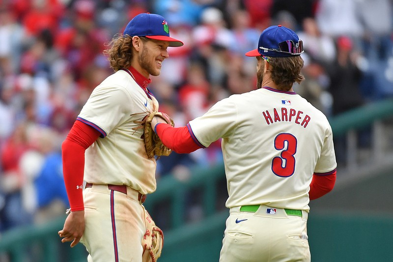 Apr 21, 2024; Philadelphia, Pennsylvania, USA; Philadelphia Phillies third base Alec Bohm (28) and first base Bryce Harper (3) celebrate win against the Chicago White Sox at Citizens Bank Park. Mandatory Credit: Eric Hartline-USA TODAY Sports