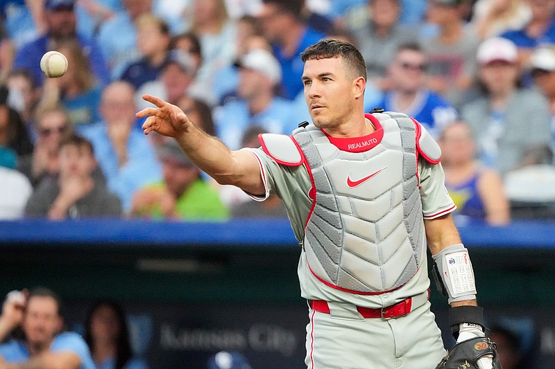 Aug 23, 2024; Kansas City, Missouri, USA; Philadelphia Phillies catcher J.T. Realmuto (10) tosses the ball back to starting pitcher Taijuan Walker (99) (not pictured) against the Kansas City Royals in the first inning at Kauffman Stadium. Mandatory Credit: Denny Medley-USA TODAY Sports