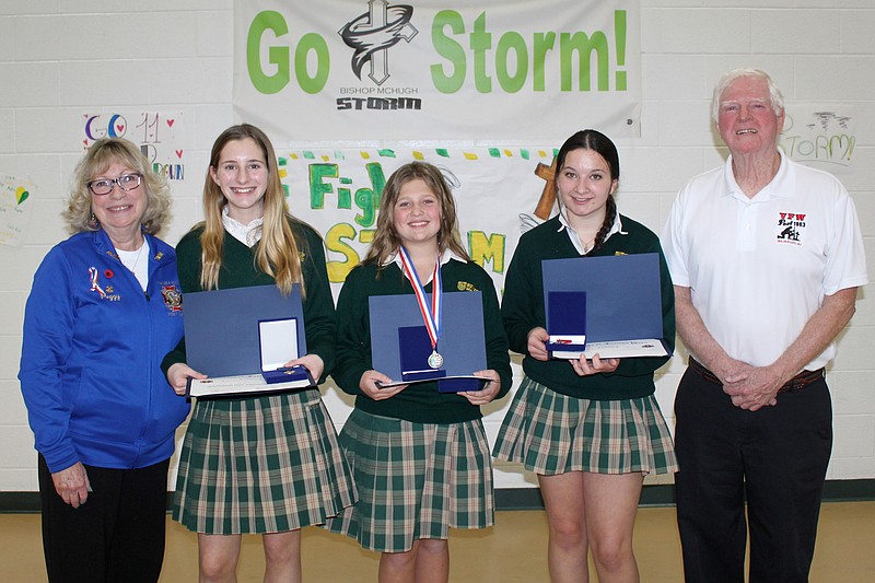 Shown with VFW Post 1963 Auxiliary President Peggy Moore and Post 1963 Adjutant Tom McCool are essay winners, from left, Myka Morris, 8th grade, Layla Mitchell, 7th grade, and Nora McMahon, 8th grade. (Photo courtesy of Sea Isle City)