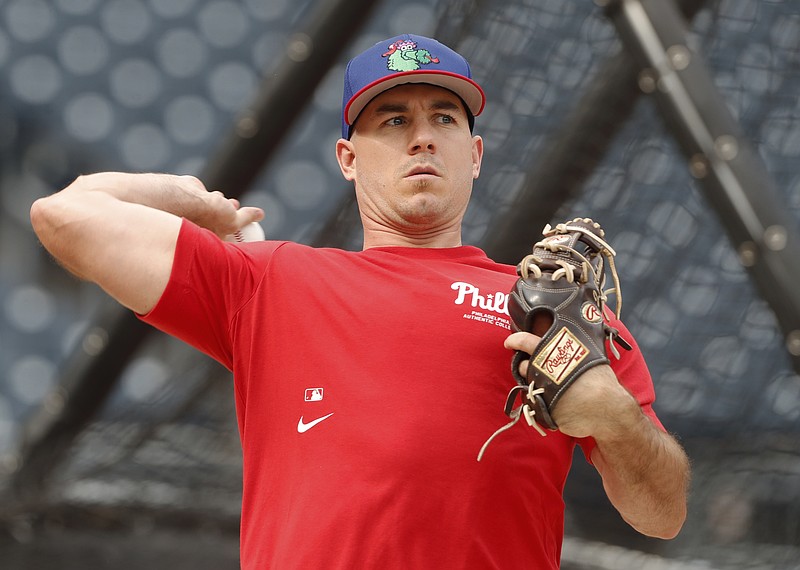 Jul 20, 2024; Pittsburgh, Pennsylvania, USA;  Philadelphia Phillies catcher J.T. Realmuto (10) warms up before a game against the Pittsburgh Pirates at PNC Park. Mandatory Credit: Charles LeClaire-USA TODAY Sports