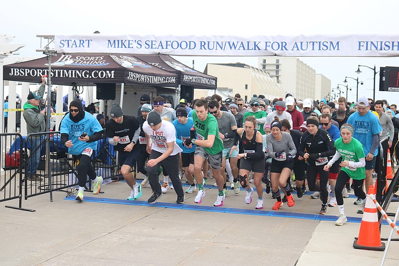 Runners break from the starting line on Sea Isle's oceanfront promenade for the Mike's Seafood Run-Walk for Autism.