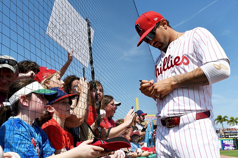 Mar 8, 2024; Clearwater, Florida, USA; Philadelphia Phillies right fielder Nick Castellanos (8) signs autographs before the start of the spring training game against the Houston Astros at BayCare Ballpark. Mandatory Credit: Jonathan Dyer-USA TODAY Sports