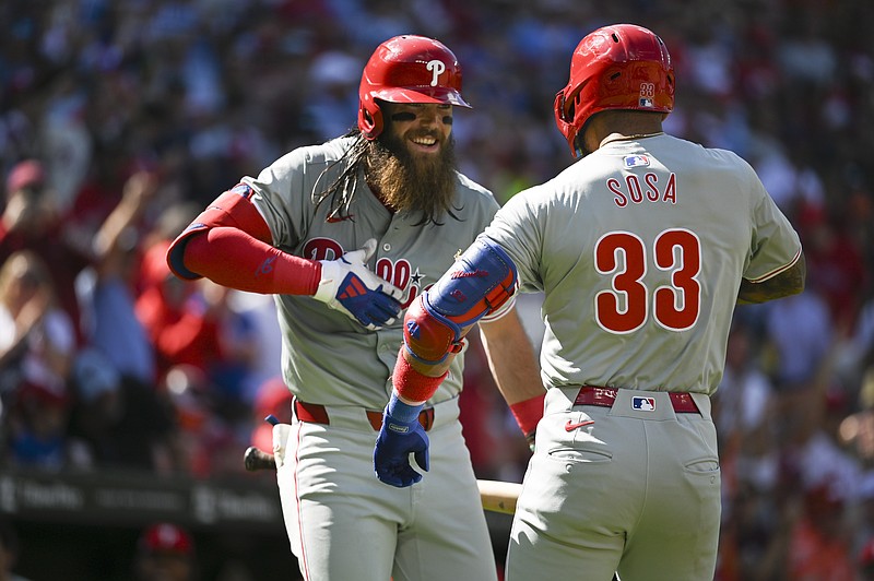 Jun 15, 2024; Baltimore, Maryland, USA;  Philadelphia Phillies shortstop Edmundo Sosa (33) celebrates with Poutfield Brandon March after hitting a solo home run in the second inning against the Baltimore Orioles  at Oriole Park at Camden Yards. Mandatory Credit: Tommy Gilligan-USA TODAY Sports