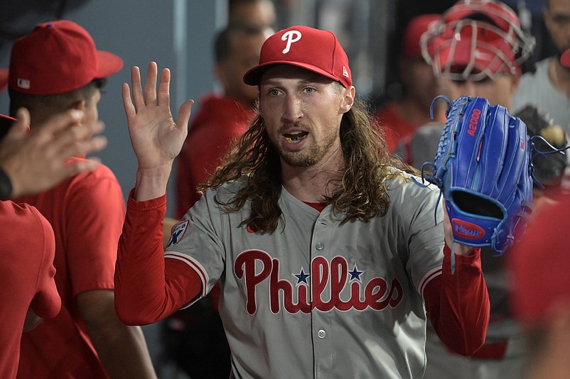 Aug 6, 2024; Los Angeles, California, USA;  Philadelphia Phillies relief pitcher Matt Strahm (25) reacts after getting Los Angeles Dodgers is congratulated in the dugout after getting designated hitter Shohei Ohtani (17) to fly out for the last out of the eighth inning at Dodger Stadium. Mandatory Credit: Jayne Kamin-Oncea-USA TODAY Sports