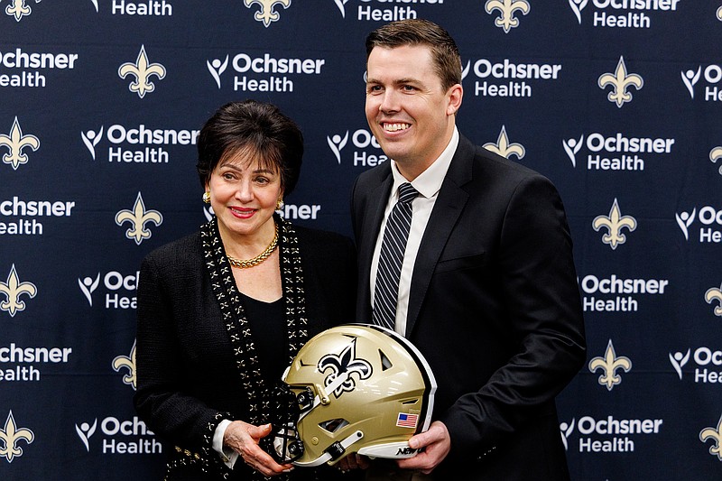 Feb 13, 2025; New Orleans, LA, USA;  New Orleans Saints owner Gayle Benson poses with the new head coach Kellen Moore at Ochsner Sports Performance Center. Mandatory Credit: Stephen Lew-Imagn Images