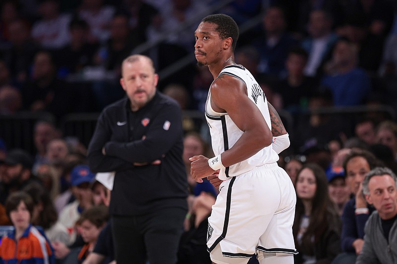 Apr 12, 2024; New York, New York, USA; Brooklyn Nets guard Lonnie Walker IV (8) runs up court after a basket in front of New York Knicks head coach Tom Thibodeau during the first half at Madison Square Garden. Mandatory Credit: Vincent Carchietta-Imagn Images