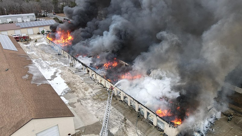 The massive fire tears through the building. (Video and photos courtesy of Dan Robinson/Dansdroneshots609)