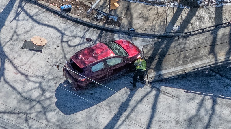 Crews are attempting to tow the car after it was involved in a car accident in Horsham Township.