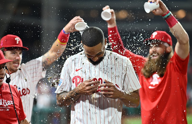 Aug 17, 2024; Philadelphia, Pennsylvania, USA; Philadelphia Phillies starting pitcher Cristopher Sanchez (61) is showered by teammates after pitching a complete game against the Washington Nationals at Citizens Bank Park. Mandatory Credit: Kyle Ross-USA TODAY Sports