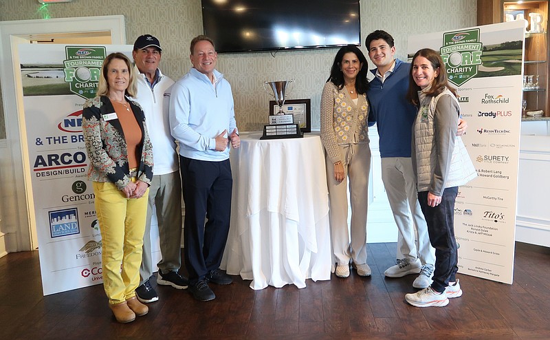 JFS/Marjorie & Lewis Katz Jewish Community Center CEO Marg Rosenblatt, Sid Brown, Jeff Brown, Tracy Brown, Stephen Brown, and Jewish Family Service of Atlantic & Cape May Counties CEO Andrea Steinberg get ready to present the trophy at the NFI & The Brown Family Golf Tournament in 2024. More than 230 players participated to raise funds for JFS and JCC programs and services.
