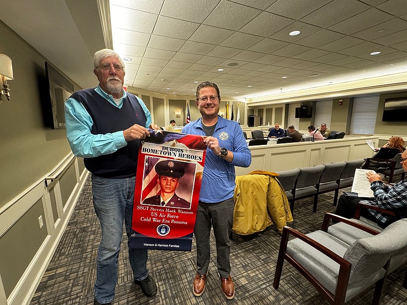 Retired Superior Court Judge James Savio and Margate Recycling Coordinator Anthony Edge hold up a sample banner honoring the city's veterans.