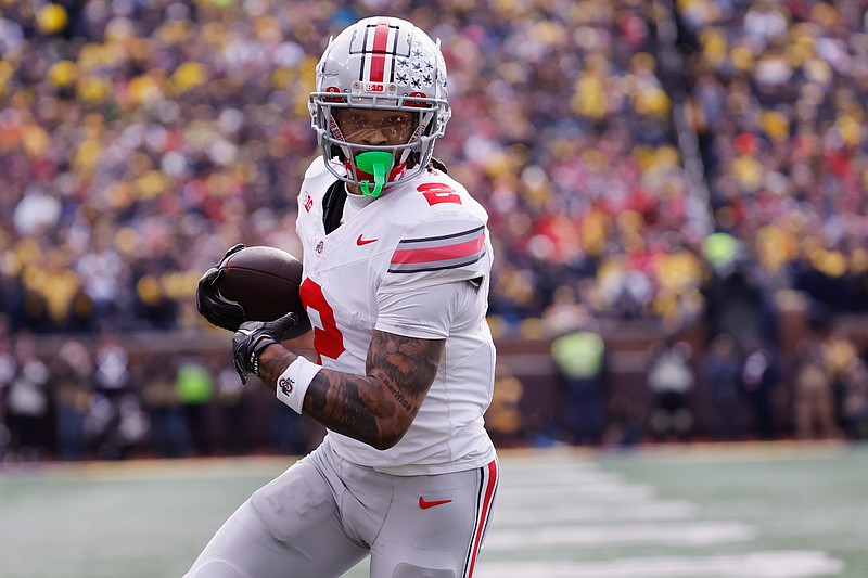 Nov 25, 2023; Ann Arbor, Michigan, USA;  Ohio State Buckeyes wide receiver Emeka Egbuka (2) makes a reception for a touchdown in the first half against the Michigan Wolverines at Michigan Stadium. Mandatory Credit: Rick Osentoski-USA TODAY Sports