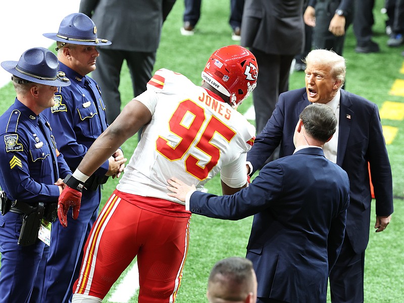 Feb 9, 2025; New Orleans, LA, USA;  Kansas City Chiefs defensive tackle Chris Jones (95) greets President Donald Trump before playing against the Philadelphia Eagles in Super Bowl LIX at Ceasars Superdome. Mandatory Credit: Stephen Lew-Imagn Images