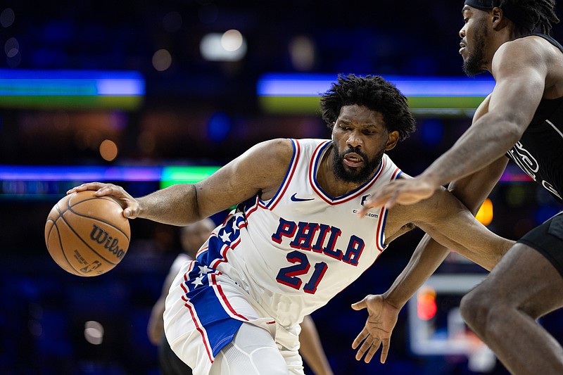 Feb 22, 2025; Philadelphia, Pennsylvania, USA; Philadelphia 76ers center Joel Embiid (21) controls the ball against Brooklyn Nets center Day'Ron Sharpe (20) during the third quarter at Wells Fargo Center. Mandatory Credit: Bill Streicher-Imagn Images