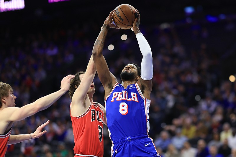 Feb 24, 2025; Philadelphia, Pennsylvania, USA; Philadelphia 76ers forward Paul George (8) drives for a shot against Chicago Bulls guard Josh Giddey (3) during the first quarter at Wells Fargo Center. Mandatory Credit: Bill Streicher-Imagn Images