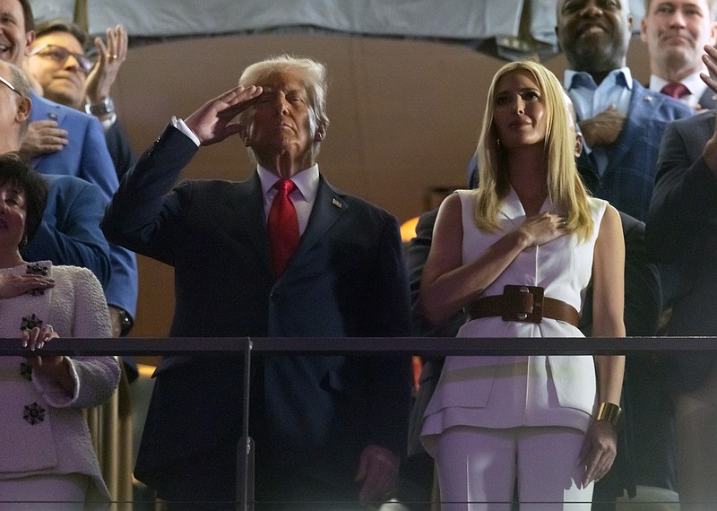 Feb 9, 2025; New Orleans, LA, USA; President Donald Trump salutes as Ivanka Trump holds her hand over her heart during the playing of the national anthem in Super Bowl LIX between the Philadelphia Eagles and the Kansas City Chiefs at Ceasars Superdome. Mandatory Credit: Mark J. Rebilas-Imagn Images