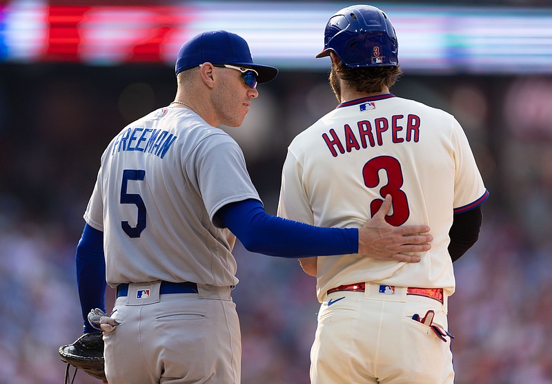 Jun 10, 2023; Philadelphia, Pennsylvania, USA; Los Angeles Dodgers first baseman Freddie Freeman (5) talks with Philadelphia Phillies designated hitter Bryce Harper (3) after Harper walked during the sixth inning at Citizens Bank Park. Mandatory Credit: Bill Streicher-USA TODAY Sports