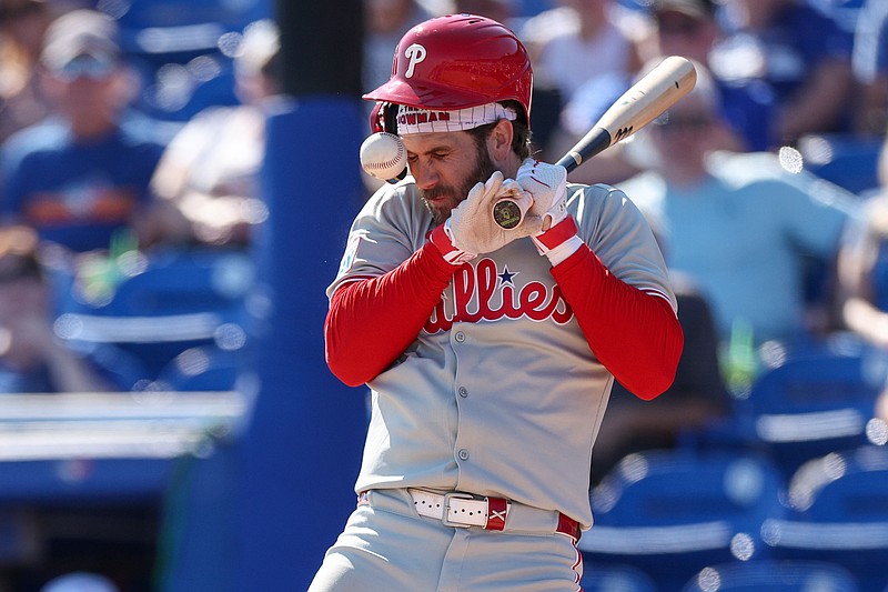 Feb 26, 2025; Dunedin, Florida, USA; Philadelphia Phillies first base Bryce Harper (3) is hit by a pitch against the Toronto Blue Jays in the sixth inning during spring training at TD Ballpark. Mandatory Credit: Nathan Ray Seebeck-Imagn Images