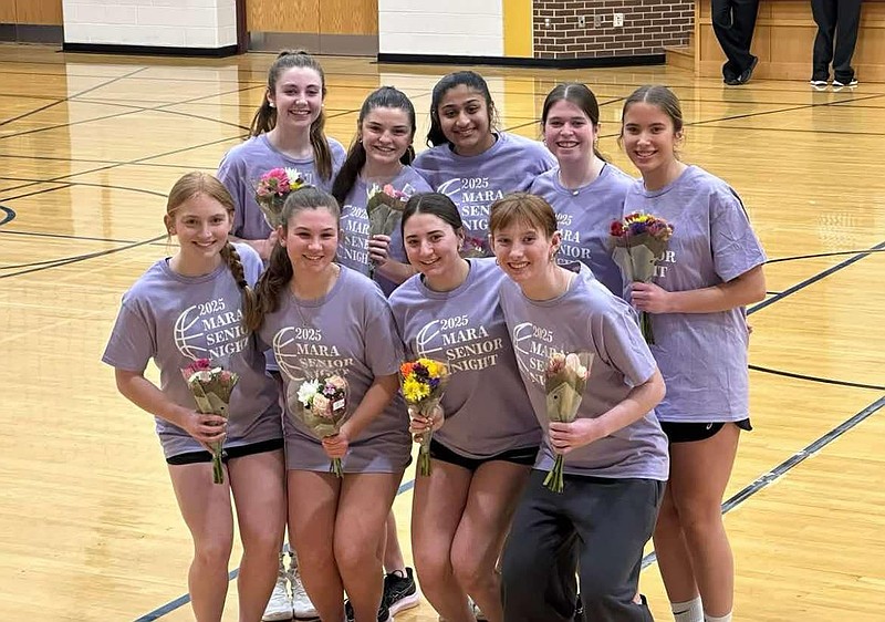 The girls' recreational basketball team celebrated its seniors at a recent game, including Maddy Washburn, the league's creator, pictured in the front row, second from left. (Image courtesy of Maddy Washburn)