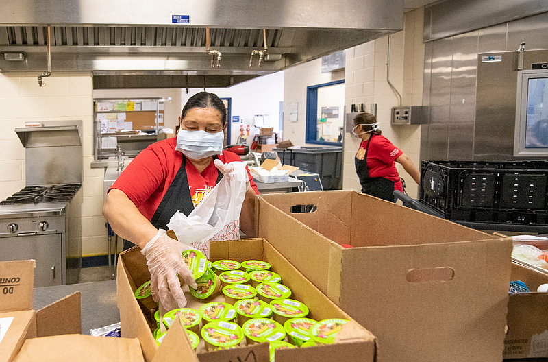 A school lunch worker preparing meals in April 2020. (Credit: Lance Cheung/Spotlight PA)