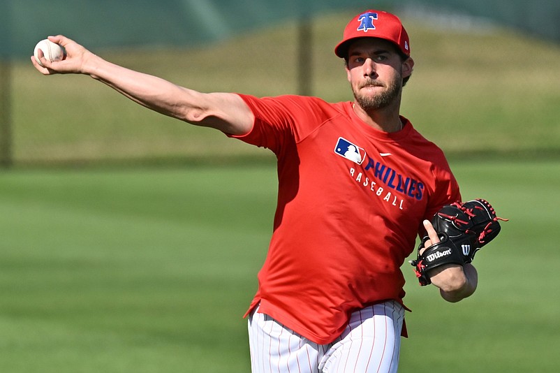 Feb 12, 2025; Clearwater, FL, USA;  Philadelphia Phillies pitcher Aaron Nola (27) warms up during a spring training workout at Carpenter Complex. Mandatory Credit: Jonathan Dyer-Imagn Images