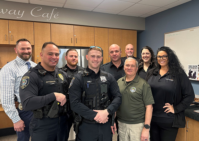 Members of Warrington Police and staff from Mission BBQ in Warminster. (Credit: Warrington Police/Crimewatch)