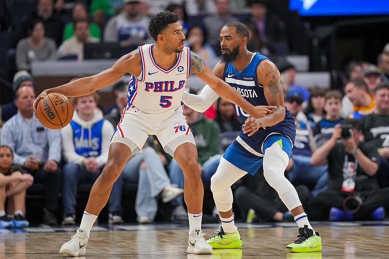 Mar 4, 2025; Minneapolis, Minnesota, USA; Philadelphia 76ers guard Quentin Grimes (5) dribbles against the Minnesota Timberwolves guard Mike Conley (10) in the first quarter at Target Center. Mandatory Credit: Brad Rempel-Imagn Images