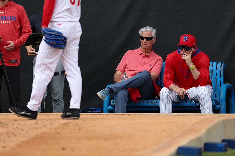 Feb 16, 2025; Clearwater, FL, USA; Philadelphia Phillies president of baseball operations Dave Dombrowski (left) and manager Rob Thomson (59) (right) watch buppben sessions spring training workouts at BayCare Ballpark. Mandatory Credit: Nathan Ray Seebeck-Imagn Images