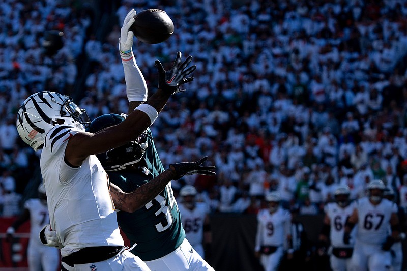 Philadelphia Eagles cornerback Isaiah Rodgers (34) tips a pass intended for Cincinnati Bengals wide receiver Ja'Marr Chase (1) before Philadelphia Eagles safety C.J. Gardner-Johnson (8) intercepts it in the fourth quarter of the NFL game at Paycor Stadium in Cincinnati on Sunday, Oct. 27, 2024.