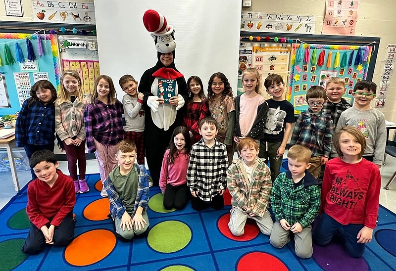 Pennridge elementary students pose for a picture with the Cat in the Hat during Read Across America week. (Credit: David Thomas)