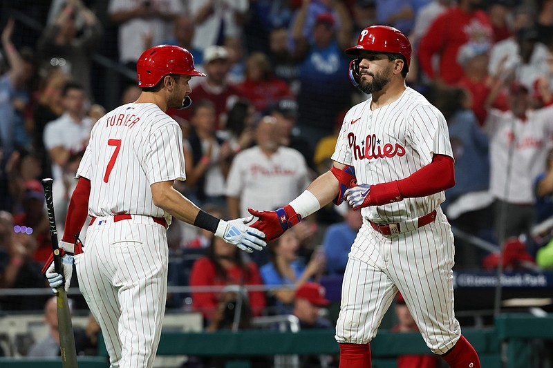 Sep 9, 2024; Philadelphia, Pennsylvania, USA; Philadelphia Phillies designated hitter Kyle Schwarber (12) shakes hands with shortstop Trea Turner (7) after hitting a solo home run during the sixth inning against the Tampa Bay Rays at Citizens Bank Park. Mandatory Credit: Bill Streicher-Imagn Images