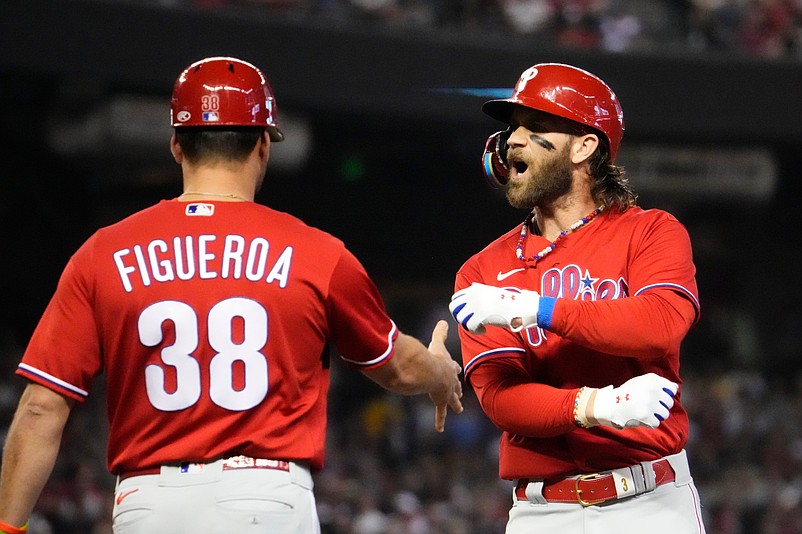 Philadelphia Phillies designated hitter Bryce Harper (3) celebrates after hitting a single against the Arizona Diamondbacks in the first inning in Game 5 of the NLCS of the 2023 MLB playoffs at Chase Field on Oct. 21, 2023, in Phoenix, AZ. The Phillies beat the Diamondbacks 6-1, giving Philadelphia the overall lead of 3-2 in the NLCS playoffs.