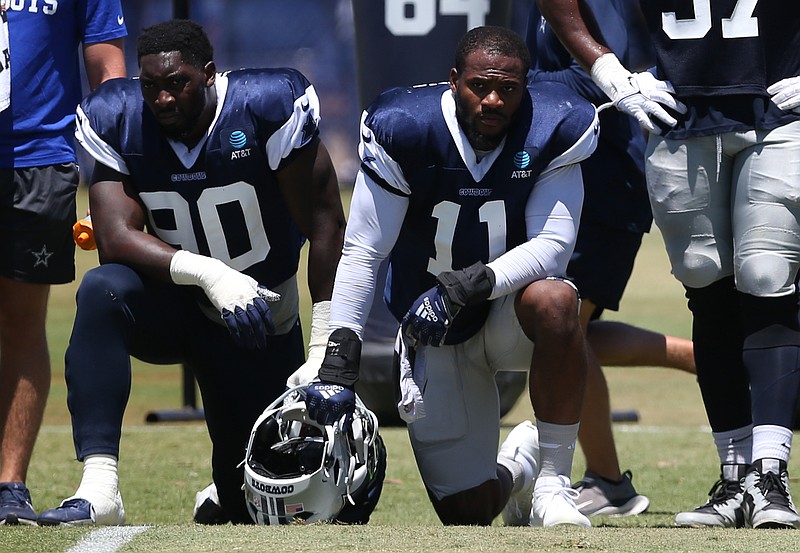 Jul 30, 2024; Oxnard, CA, USA; Dallas Cowboys defensive end DeMarcus Lawrence (90) and linebacker Micah Parsons (11) during training camp at the River Ridge Playing Fields in Oxnard, California. Mandatory Credit: Jason Parkhurst-USA TODAY Sports