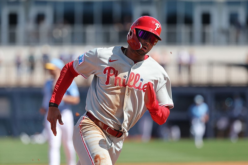 Feb 25, 2025; Port Charlotte, Florida, USA;  Philadelphia Phillies outfielder Justin Crawford (80) runs home to score against the Tampa Bay Rays during the fourth inning at Charlotte Sports Park. Mandatory Credit: Kim Klement Neitzel-Imagn Images