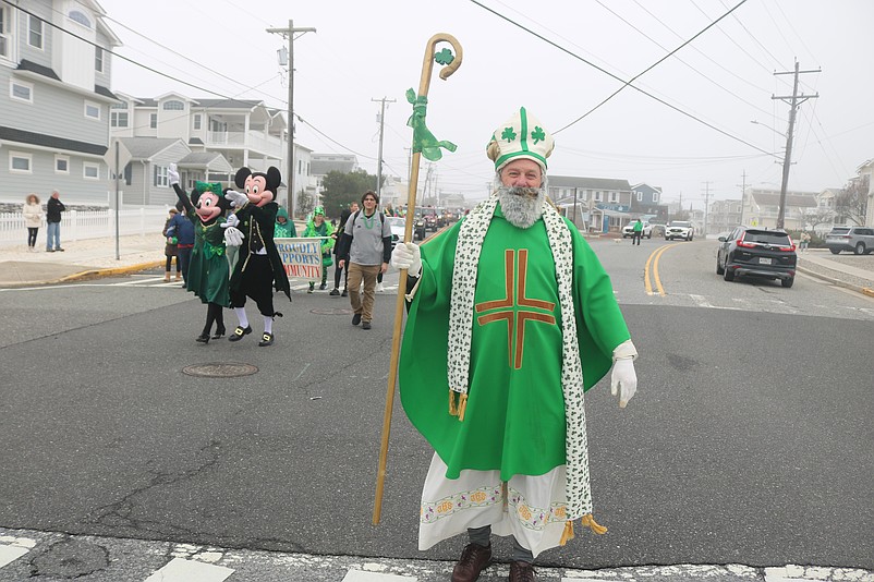 Sea Isle City resident Tim Kelly, who often portrays St. Patrick, shows off his elaborate costume while marching in the 2025 parade.