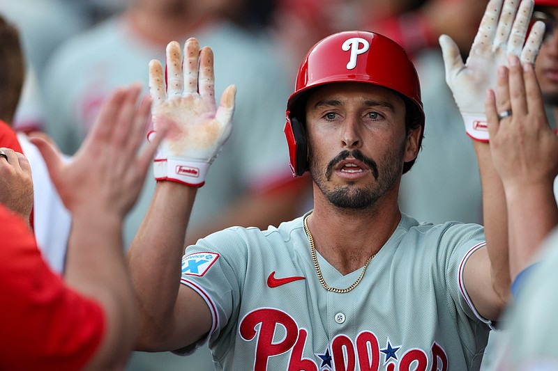 Mar 14, 2025; Tampa, Florida, USA; Philadelphia Phillies catcher Garrett Stubbs (21) celebrates after scoring a run against the New York Yankees in the second inning during spring training at George M. Steinbrenner Field. Mandatory Credit: Nathan Ray Seebeck-Imagn Images