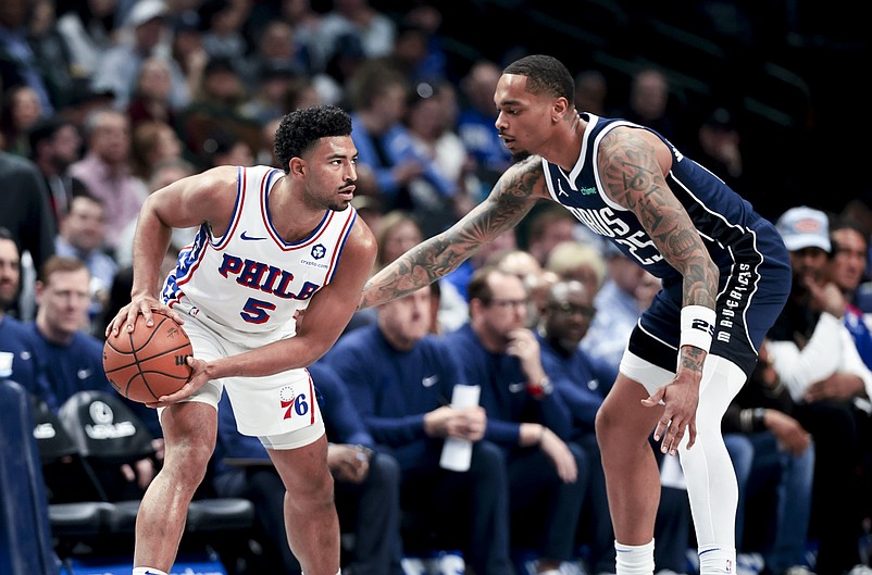 Mar 16, 2025; Dallas, Texas, USA; Philadelphia 76ers guard Quentin Grimes (5) looks to score as Dallas Mavericks forward P.J. Washington (25) defends during the first half at American Airlines Center. Mandatory Credit: Kevin Jairaj-Imagn Images