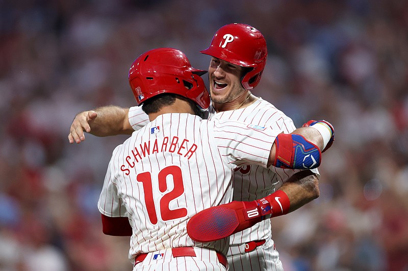 Aug 14, 2024; Philadelphia, Pennsylvania, USA; Philadelphia Phillies designated hitter Kyle Schwarber (12) celebrates with catcher J.T. Realmuto (10) after hitting a four RBI grand slam during the fourth inning against the Miami Marlins at Citizens Bank Park. Mandatory Credit: Bill Streicher-USA TODAY Sports