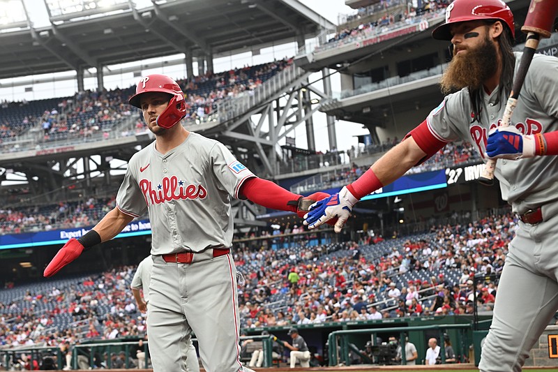 Sep 29, 2024; Washington, District of Columbia, USA; Philadelphia Phillies shortstop Trea Turner (7) celebrates scoring a run with left fielder Brandon Marsh (16) against the Washington Nationals during the first inning at Nationals Park. Mandatory Credit: Rafael Suanes-Imagn Images