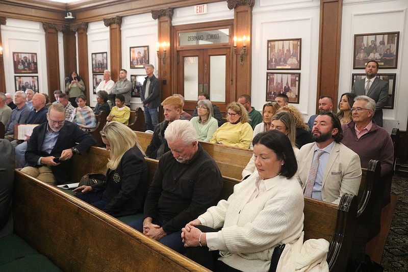 The audience packs the zoning board hearing for the doggie hotel project.