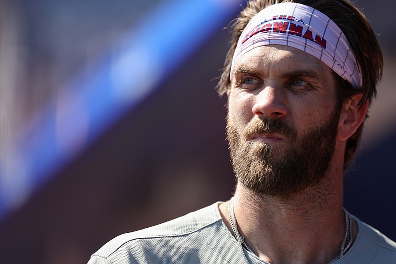 Feb 26, 2025; Dunedin, Florida, USA; Philadelphia Phillies first baseman Bryce Harper (3) looks on =from the dugout against the Toronto Blue Jays in the fifth inning during spring training at TD Ballpark. Mandatory Credit: Nathan Ray Seebeck-Imagn Images