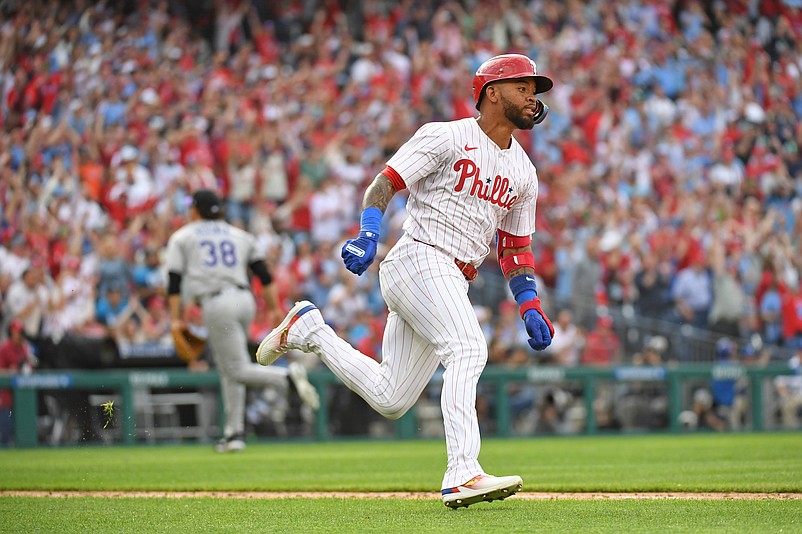 Mar 31, 2025; Philadelphia, Pennsylvania, USA; Philadelphia Phillies shortstop Edmundo Sosa (33) hits a hits a two RBI double during the seventh inning against the Colorado Rockies at Citizens Bank Park. Mandatory Credit: Eric Hartline-Imagn Images