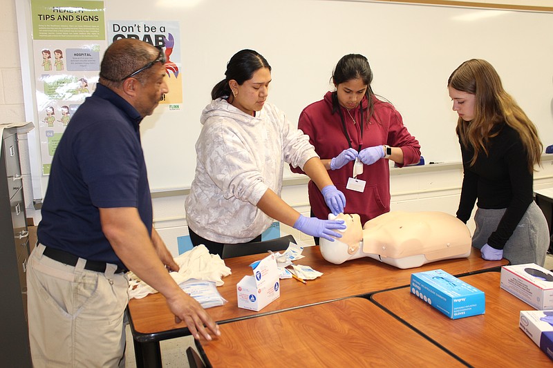 Healthcare professionals guide ACIT Health Science students through essential field techniques.