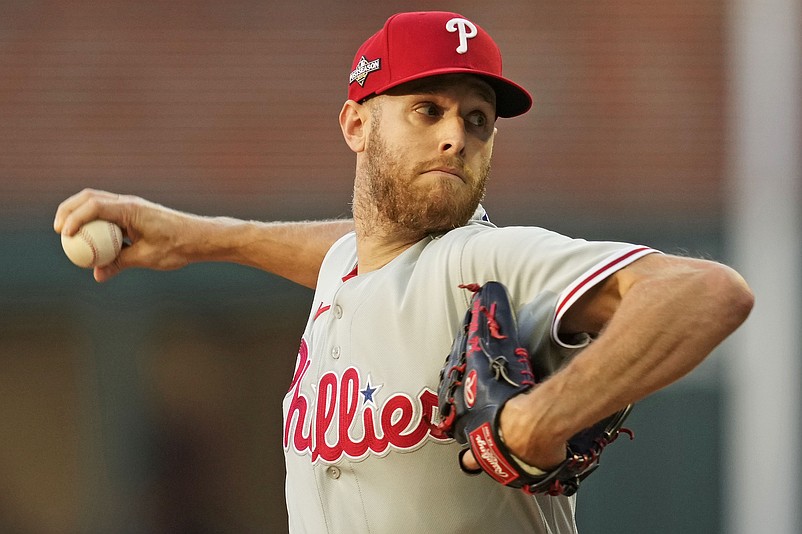 Oct 9, 2023; Cumberland, Georgia, USA; Philadelphia Phillies starting pitcher Zack Wheeler (45) pitches during the first inning against the Atlanta Braves in game two of the NLDS for the 2023 MLB playoffs at Truist Park. Mandatory Credit: Dale Zanine-USA TODAY Sports