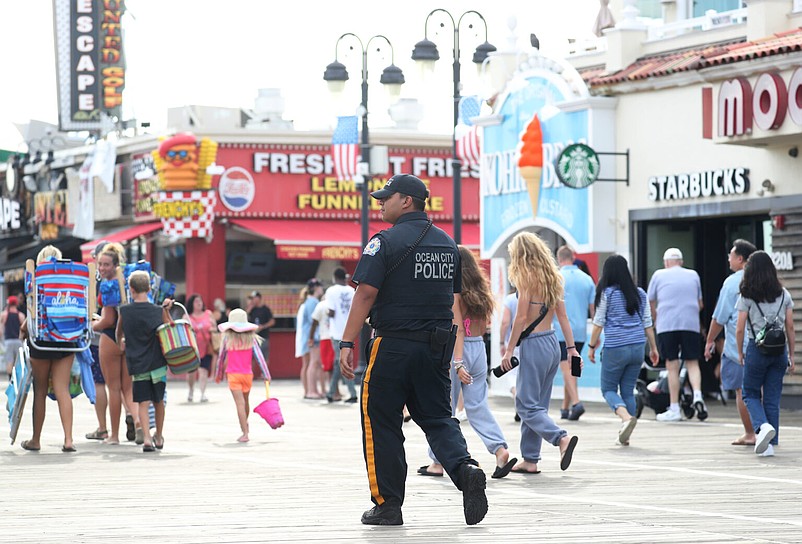 A police officer monitors activity on the boardwalk in Ocean City, N.J., Friday, Aug. 11, 2023. (Lori M. Nichols for New Jersey Monitor)